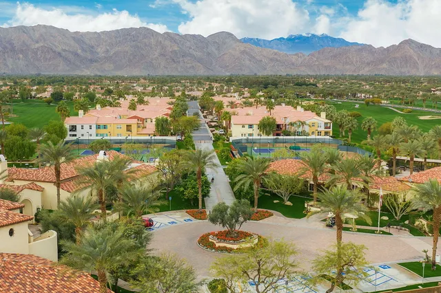 an aerial view of lake and residential houses with outdoor space
