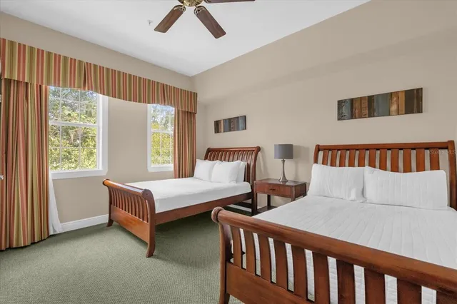 a bedroom with double bed and a window