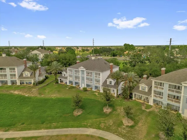 a view of a big house with a big yard