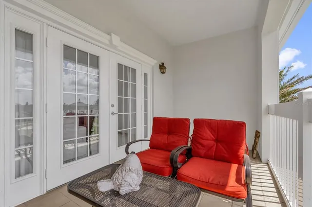 a blue couch sitting in front of a window