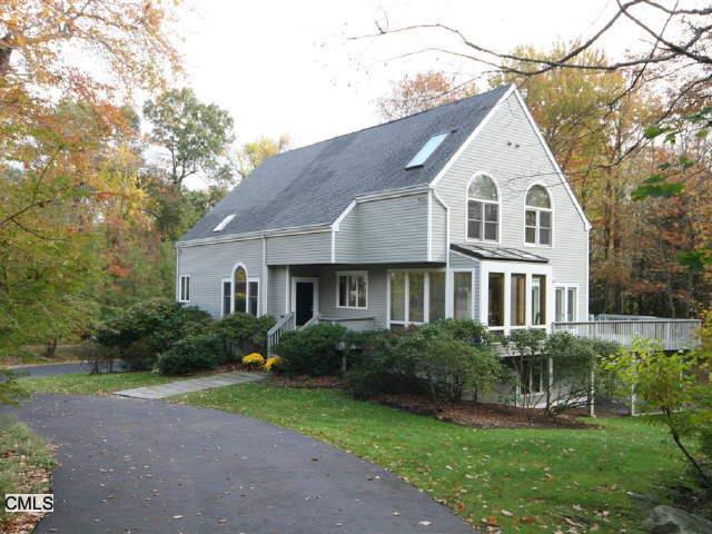10 Morganti Court Ridgefield, CT 06877 - Photo 1 of 1 a front view of a house with a yard