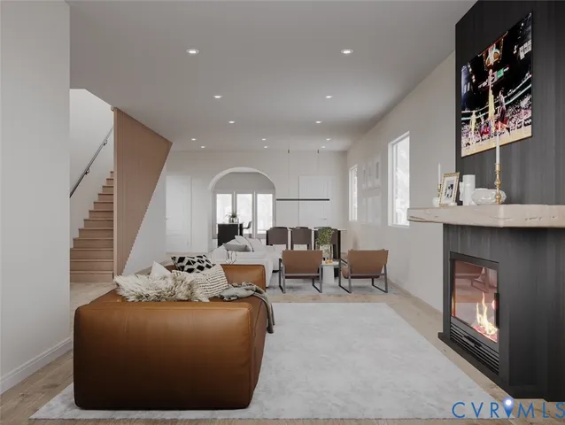 a living room with fireplace furniture and a fireplace