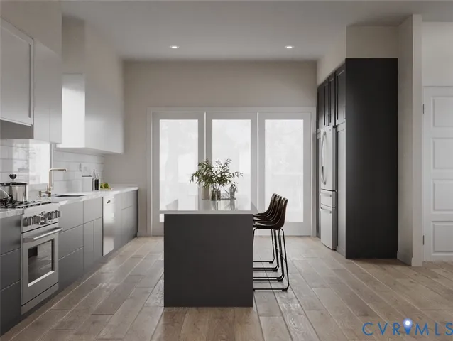 a kitchen with a table and chairs