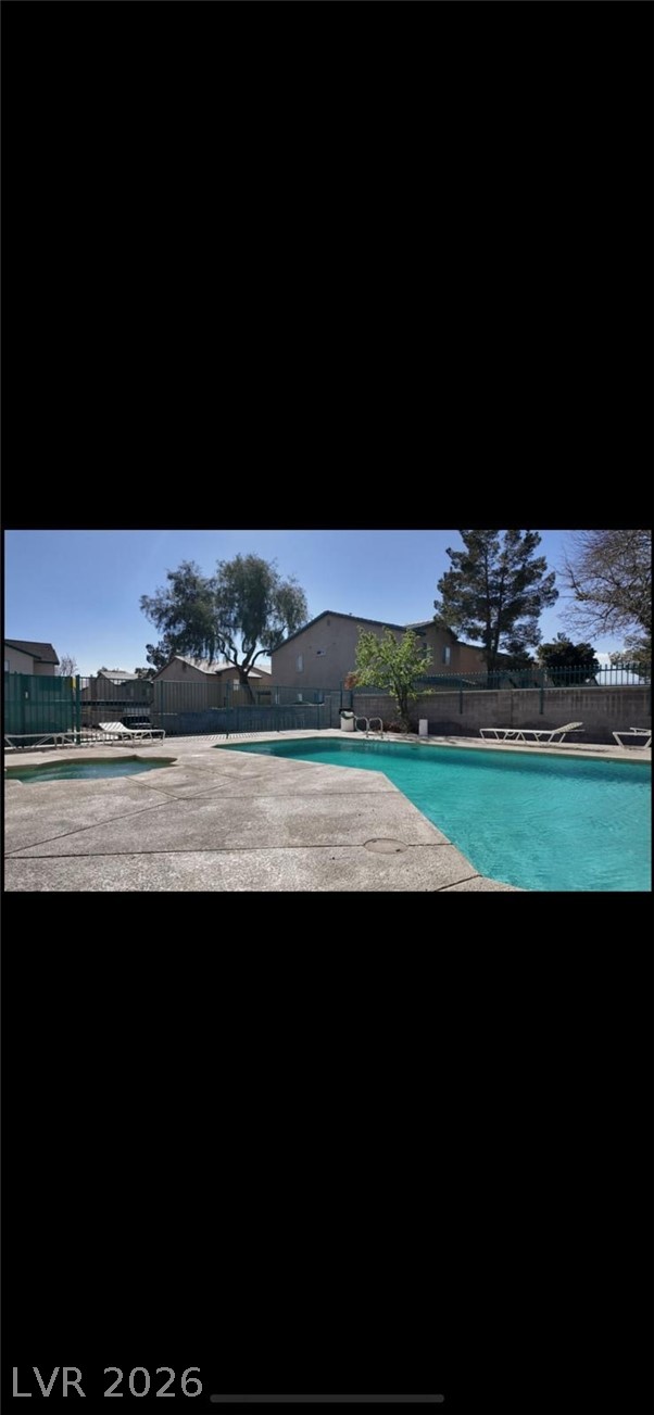 5131 South Lindell Road, Unit 205 Las Vegas, NV 89118 - Photo 22 of 22 Community pool featuring fence