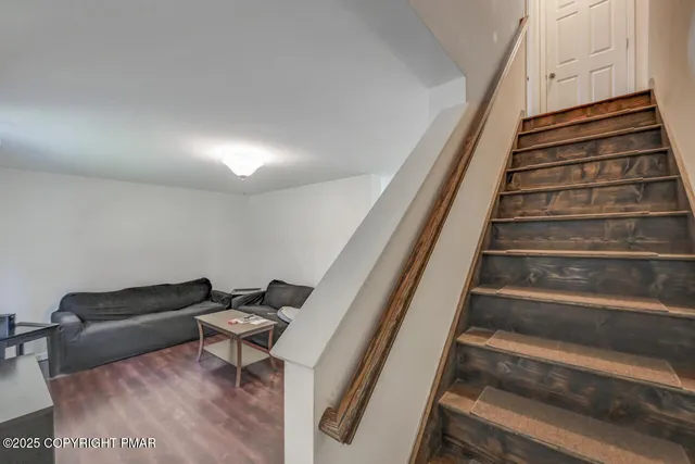 a bathroom with a sink and mirror with toilet
