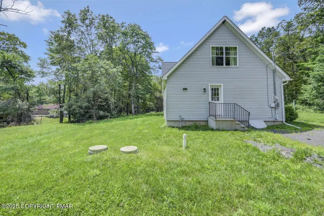 a kitchen with stainless steel appliances kitchen island granite countertop a stove and a sink