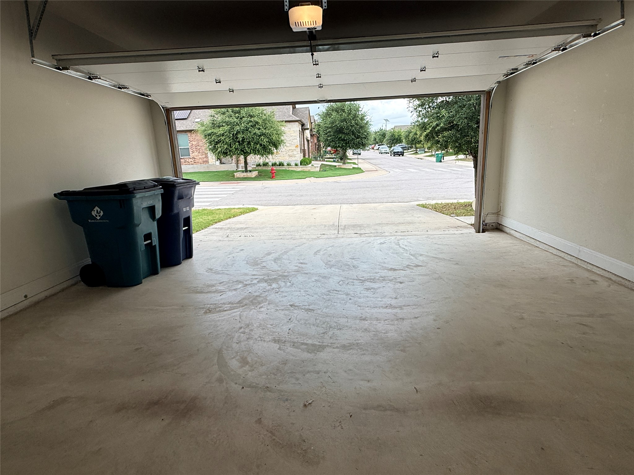 2101 Split Diamond Way, Unit 40 Round Rock, TX 78664 - Photo 16 of 32 Secure parking with concrete flooring and convenient access to the neighborhood street.