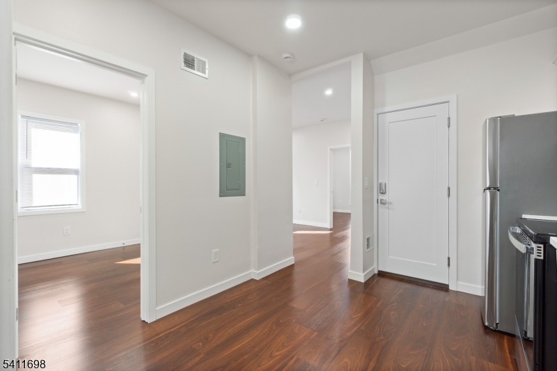 826 George Street, Unit 1 Plainfield, NJ 07062 - Photo 11 of 21 a view of a hallway with wooden floor