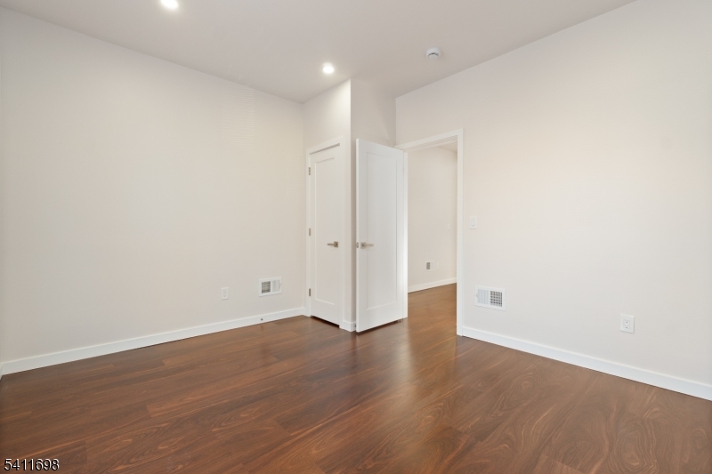 826 George Street, Unit 1 Plainfield, NJ 07062 - Photo 13 of 21 a view of an empty room with wooden floor