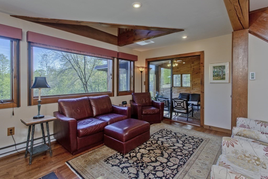 135 George Lamb Road Leyden, MA 01337 - Photo 18 of 42 a living room with furniture and a large window