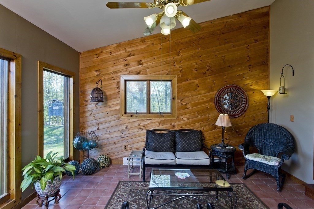 135 George Lamb Road Leyden, MA 01337 - Photo 22 of 42 a living room with furniture and a potted plant