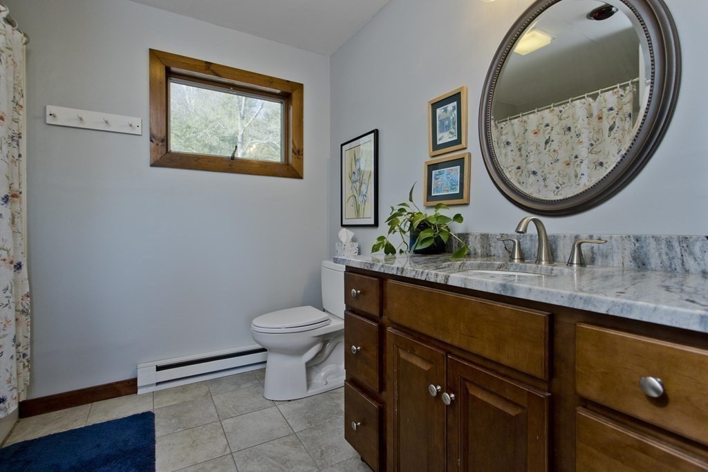 135 George Lamb Road Leyden, MA 01337 - Photo 37 of 42 a bathroom with a toilet a sink and a mirror