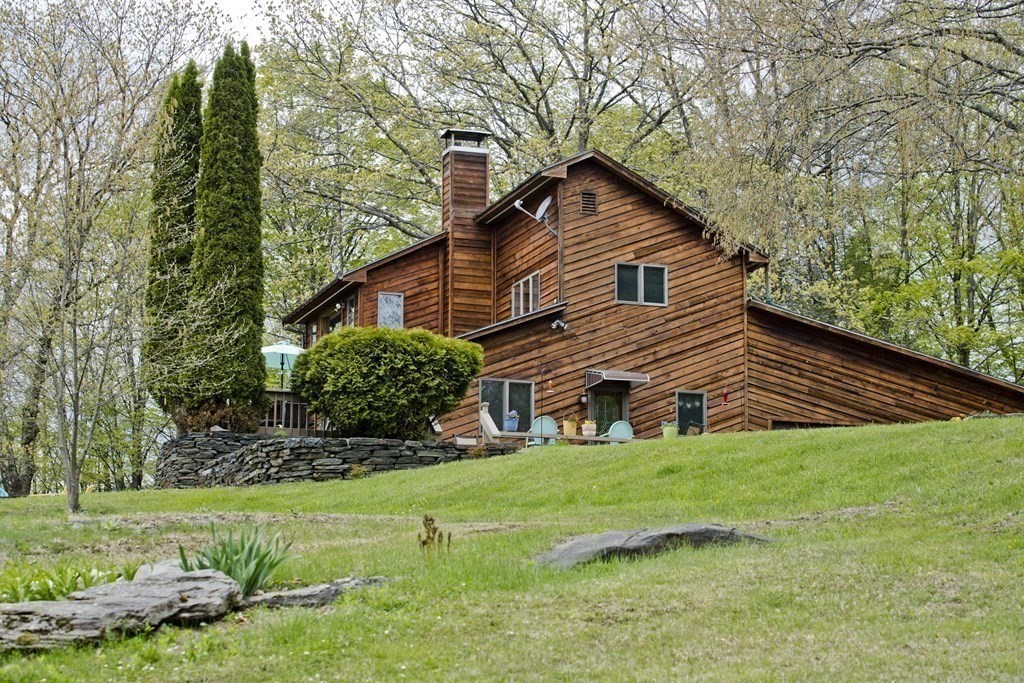 135 George Lamb Road Leyden, MA 01337 - Photo 40 of 42 a house view with a garden space