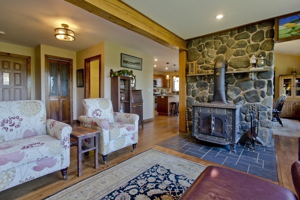 135 George Lamb Road Leyden, MA 01337 - Photo 9 of 42 a bedroom with furniture and a fireplace