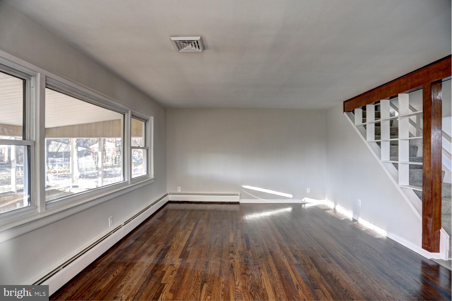 414 Berryhill Road Harrisburg, PA 17109 - Photo 6 of 38 Living Room - Big Window Overlooking Sunroom