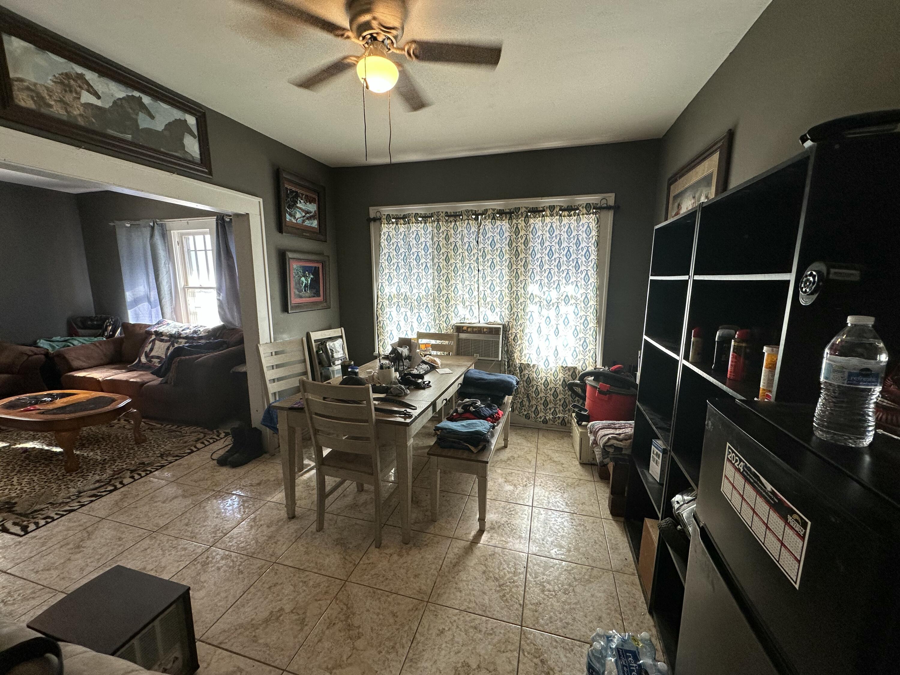 611 Denver Plainview, TX 79072 - Photo 3 of 8 a living room with lots of furniture and a window