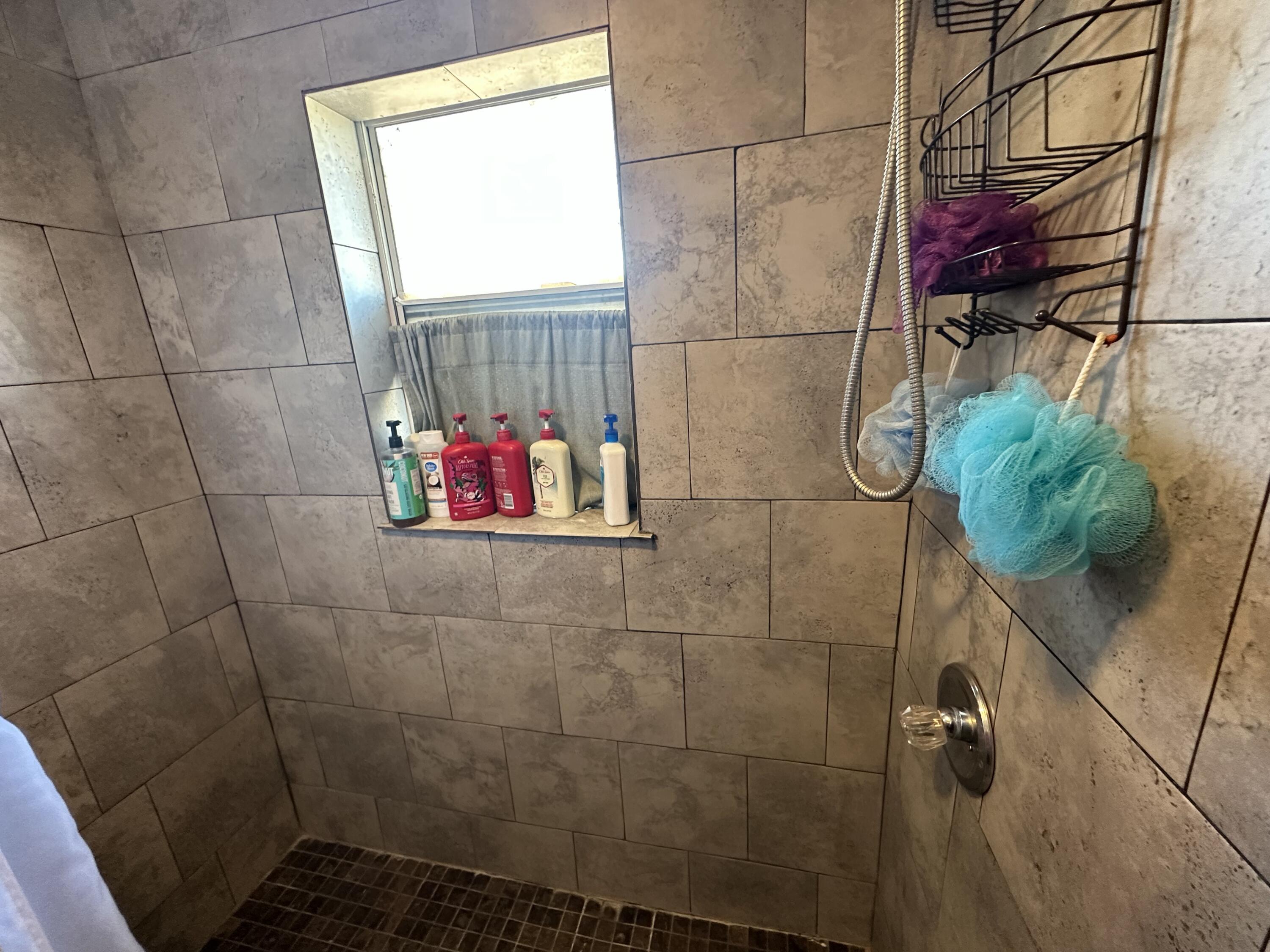 611 Denver Plainview, TX 79072 - Photo 5 of 8 a bathroom with a shower