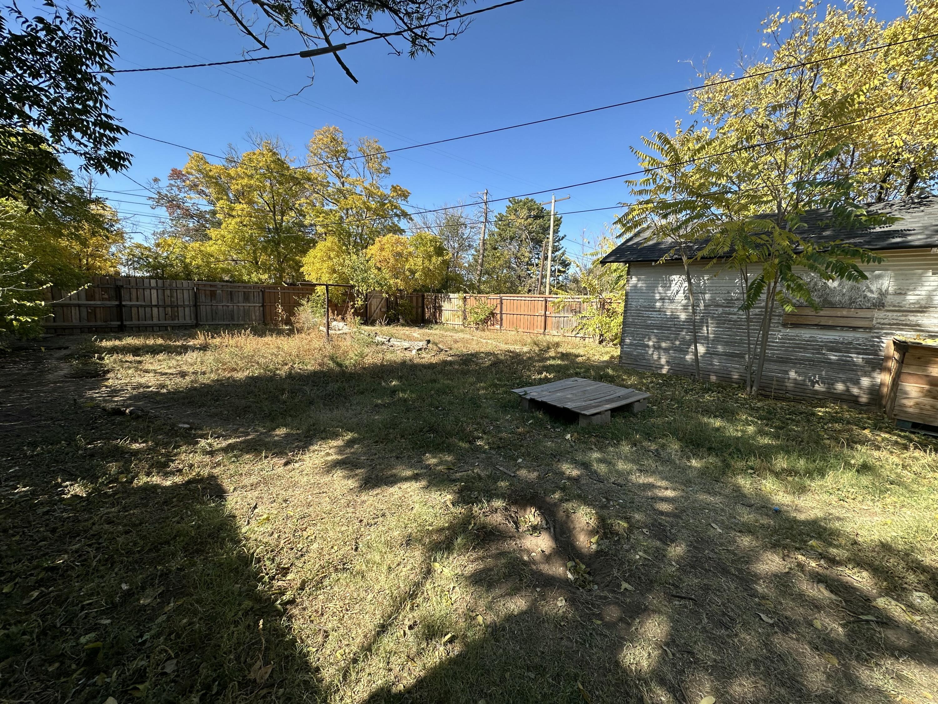 611 Denver Plainview, TX 79072 - Photo 8 of 8 a backyard of a house with lots of green space