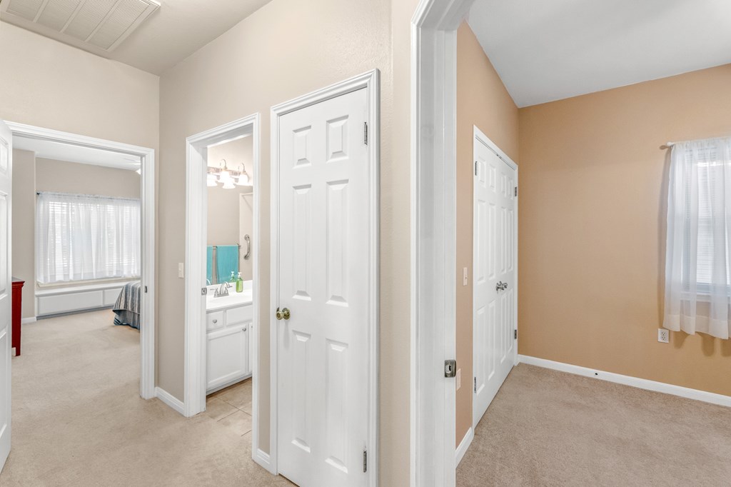225 Los Cedros Loop Kerrville, TX 78028 - Photo 17 of 27 an entryway with a cabinet and a door