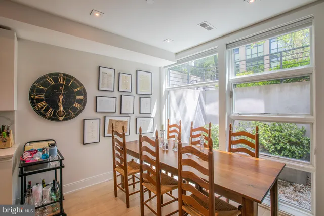 a view of a dining room with furniture wooden floor and a window