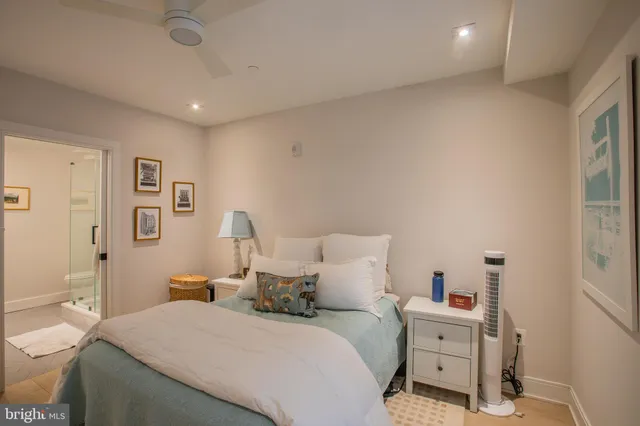 a bedroom with a bed and a desk