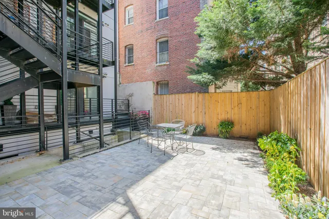 a view of backyard with patio