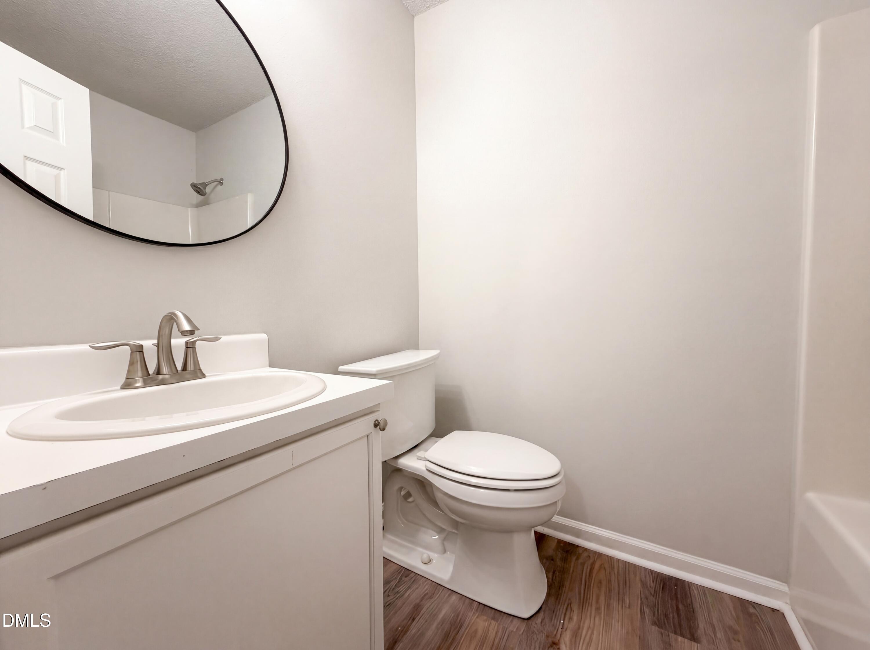 4894 Elevation Road, Unit C Benson, NC 27504 - Photo 16 of 24 a bathroom with a sink and a toilet