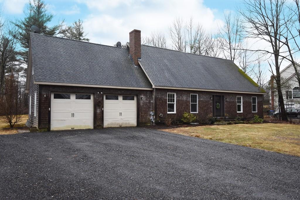 256 Glenwood Road Rutland, MA 01543 - Photo 1 of 30 a front view of a house with a yard
