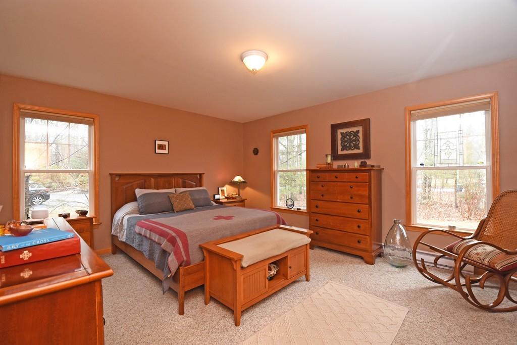 256 Glenwood Road Rutland, MA 01543 - Photo 12 of 30 a bedroom with a bed and dresser with chair