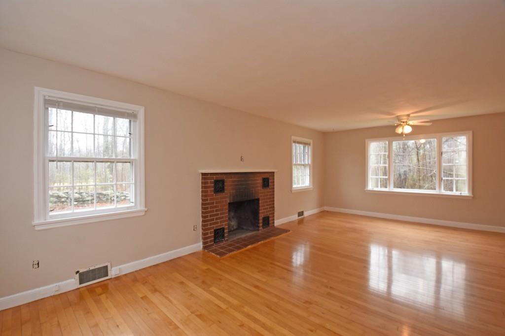 256 Glenwood Road Rutland, MA 01543 - Photo 16 of 30 a view of an empty room with a window and fireplace