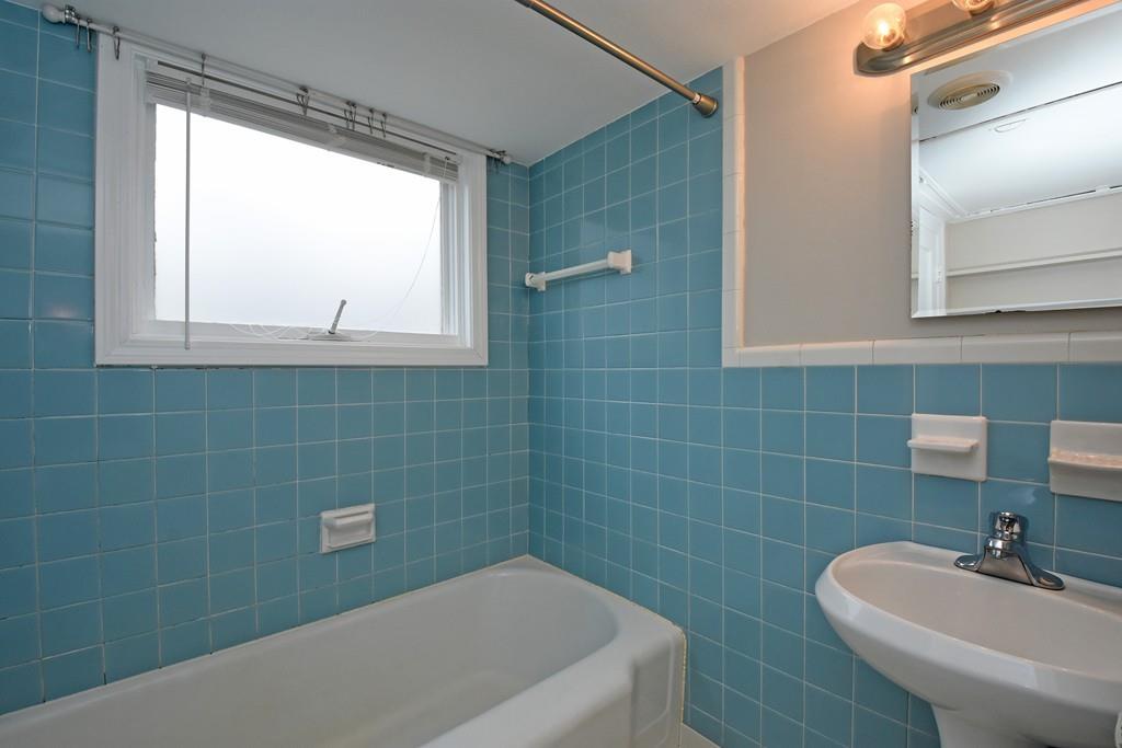 256 Glenwood Road Rutland, MA 01543 - Photo 23 of 30 a bathroom with a sink a toilet a window and bathtub