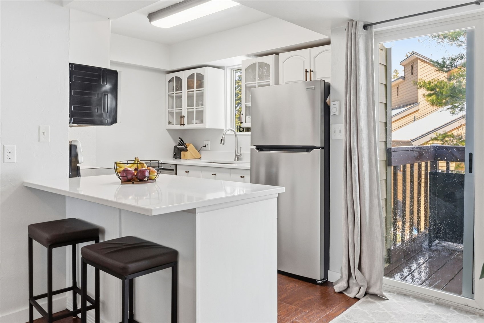 6920 Ryan Gulch Road, Unit 6920 Silverthorne, CO 80498 - Photo 12 of 48 a kitchen with stainless steel appliances a refrigerator and a stove