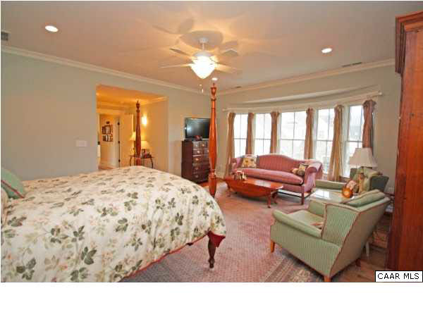 5153 Brook View Road Crozet, VA 22932 - Photo 34 of 48 a living room with furniture and a chandelier