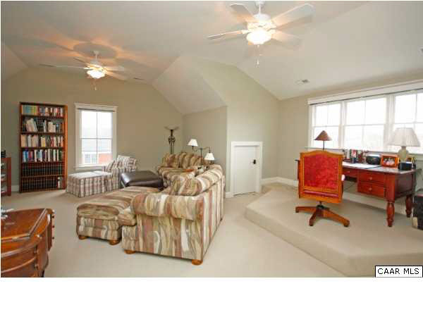 5153 Brook View Road Crozet, VA 22932 - Photo 40 of 48 a living room with furniture and a chandelier