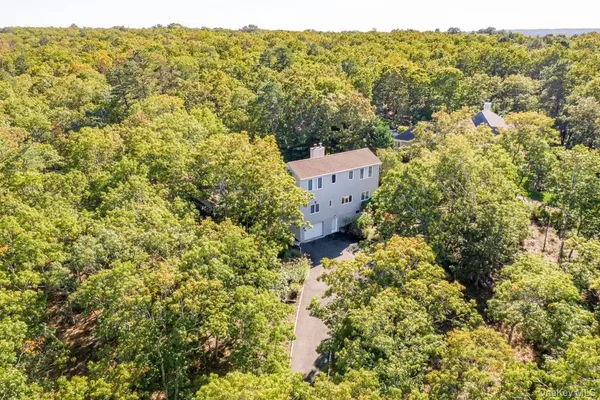 an aerial view of residential house with outdoor space