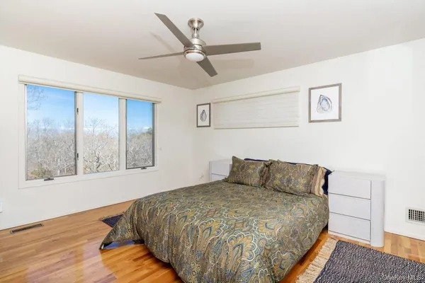 a bedroom with a bed and window