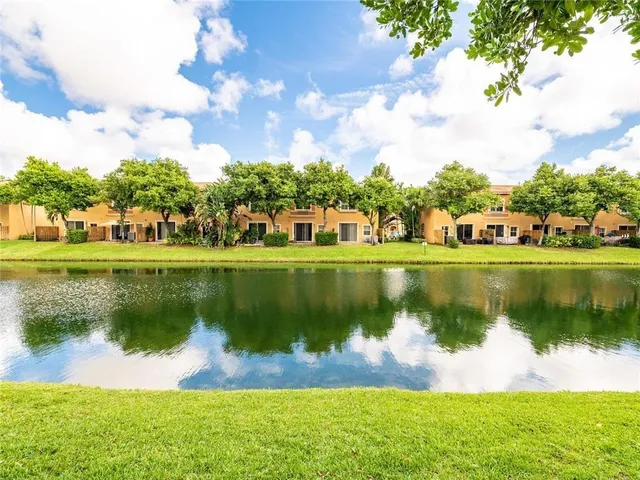 a view of a lake with a big yard