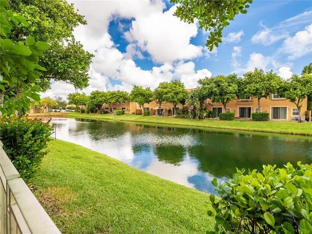 a view of a lake with a house in the background