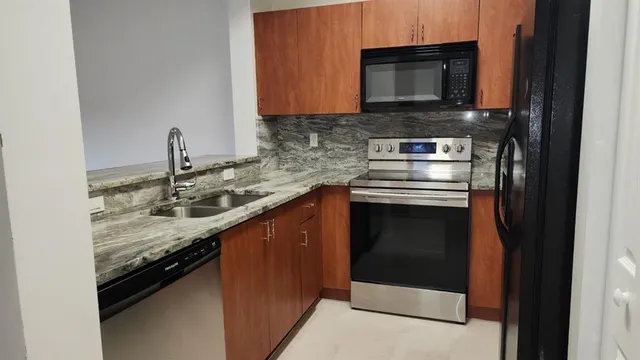 a kitchen with a stove and a microwave