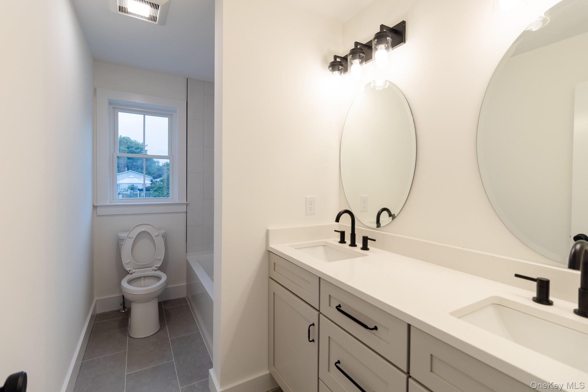 750 Ridgebury Road Slate Hill, NY 10973 - Photo 33 of 41 a bathroom with a sink and a toilet