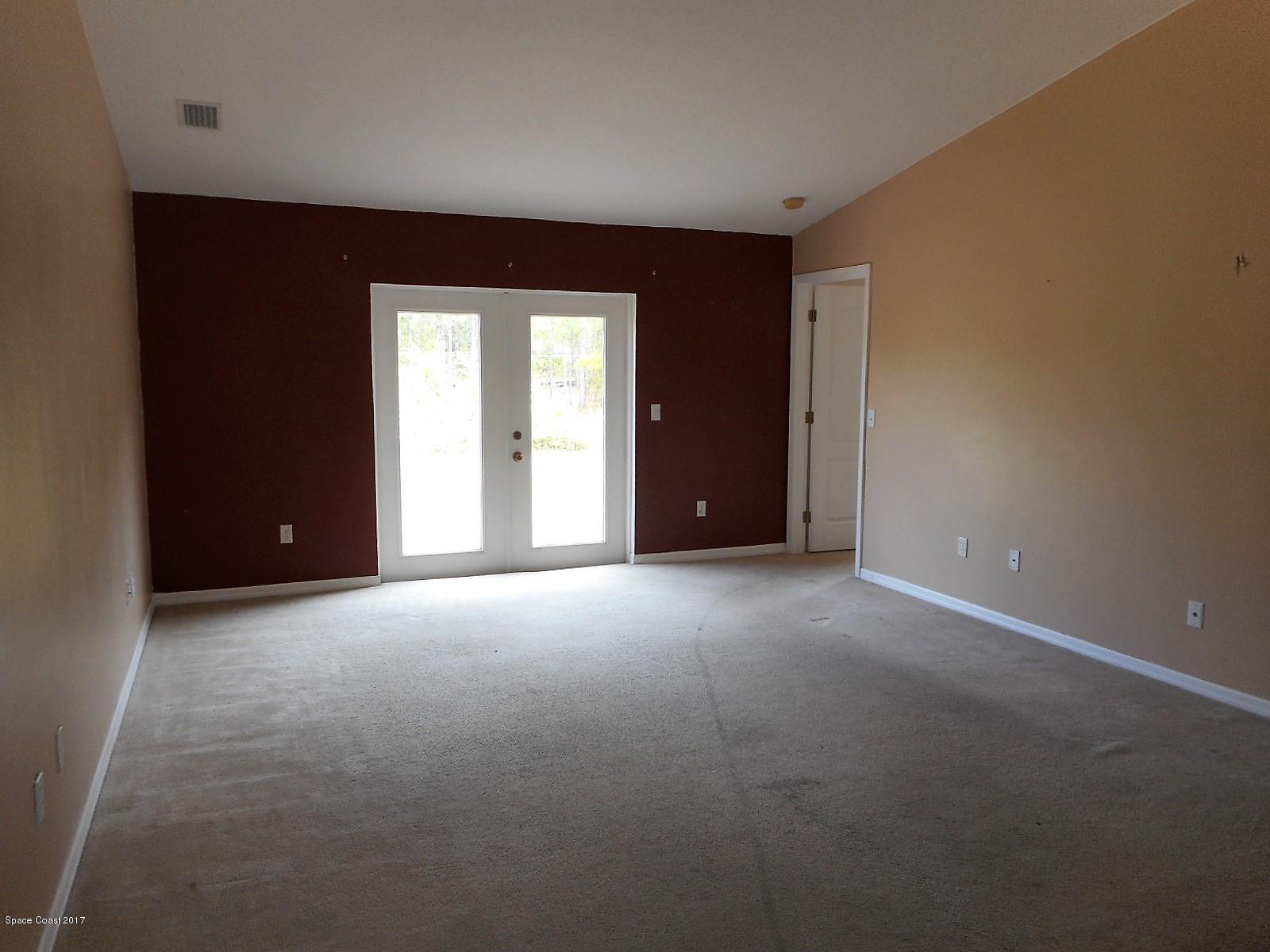 2174 Watkins Road Southeast Palm Bay, FL 32909 - Photo 3 of 13 Living-dining combo