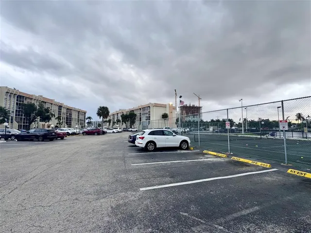 a view of street with parked cars