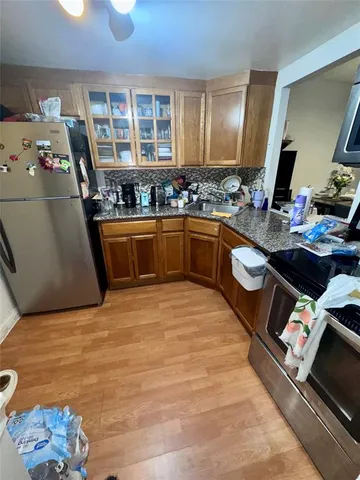 a room with a bed and a flat screen tv