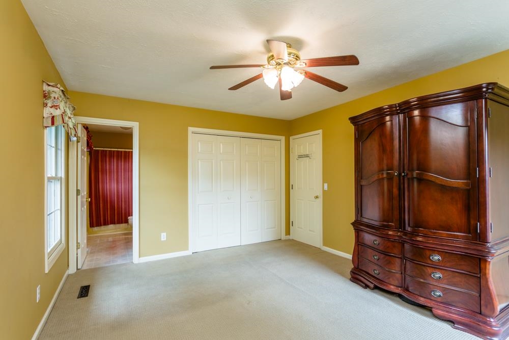 87 Bluestone Drive Weyers Cave, VA 24486 - Photo 12 of 37 an empty room with windows and cabinet