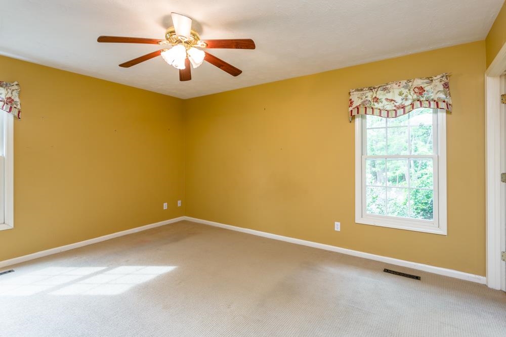 87 Bluestone Drive Weyers Cave, VA 24486 - Photo 13 of 37 an empty room with a window and a ceiling fan
