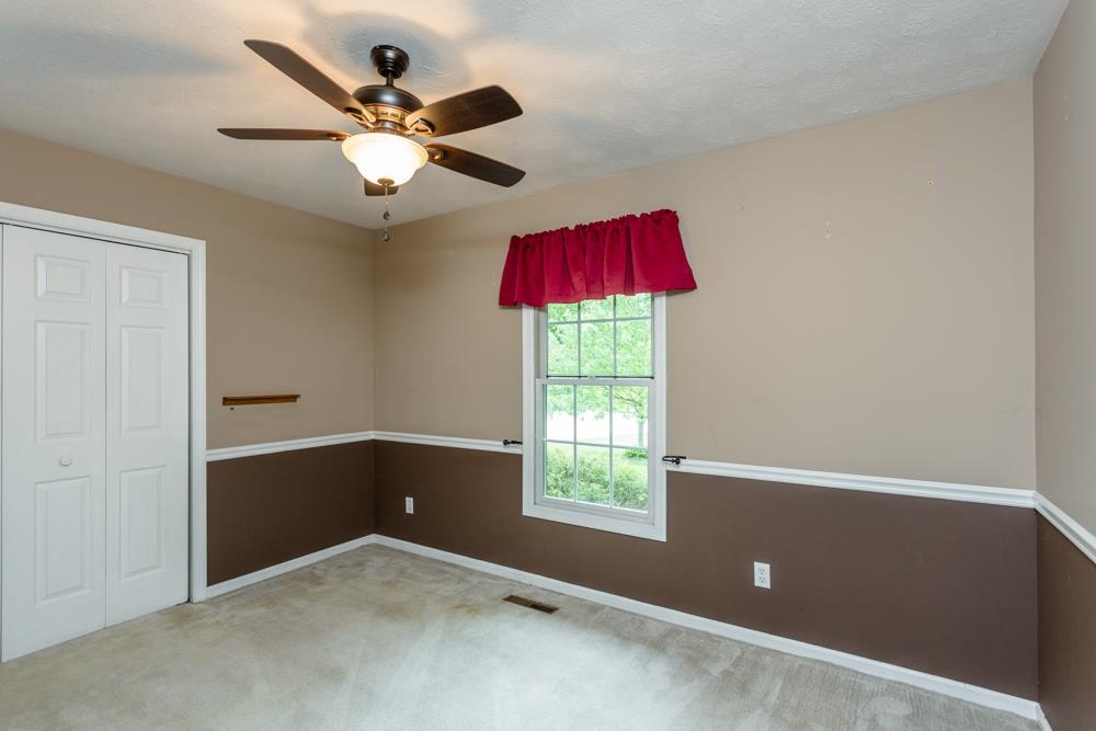 87 Bluestone Drive Weyers Cave, VA 24486 - Photo 15 of 37 an empty room with a window and a ceiling fan
