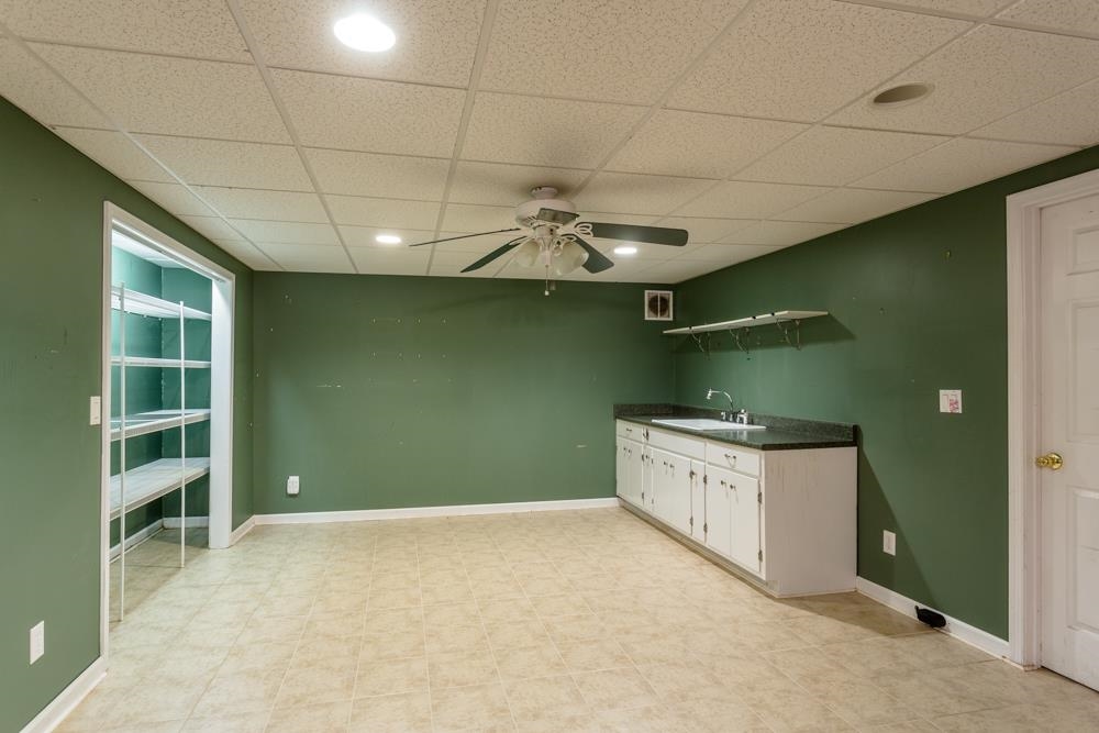 87 Bluestone Drive Weyers Cave, VA 24486 - Photo 18 of 37 a kitchen with a cabinets and chandelier