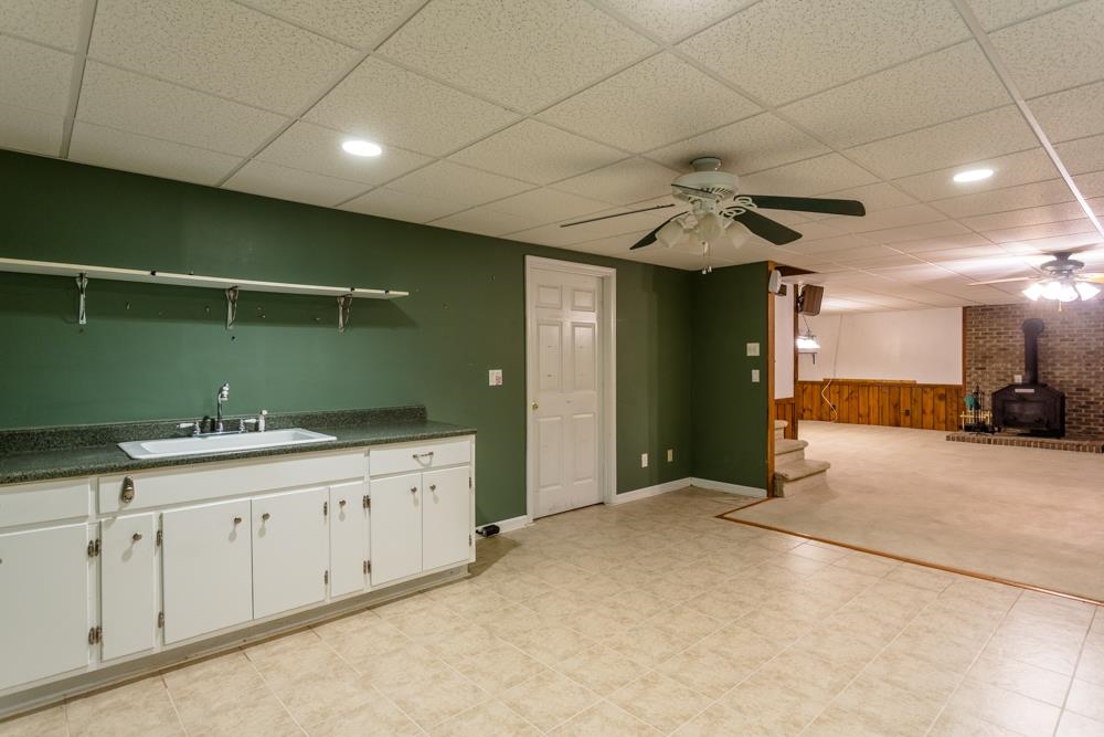 87 Bluestone Drive Weyers Cave, VA 24486 - Photo 19 of 37 a spacious bathroom with a granite countertop sink and a mirror
