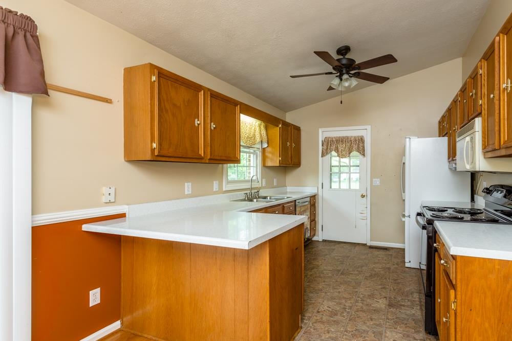 87 Bluestone Drive Weyers Cave, VA 24486 - Photo 3 of 37 a kitchen with a sink appliances and cabinets