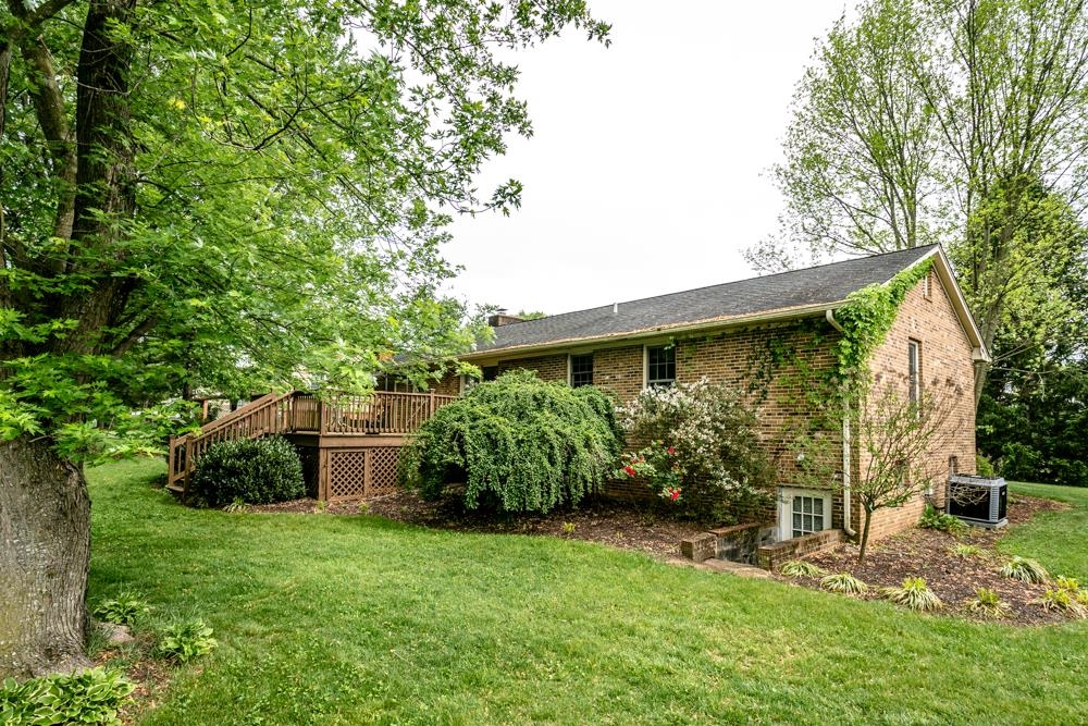 87 Bluestone Drive Weyers Cave, VA 24486 - Photo 31 of 37 a view of a house with a garden